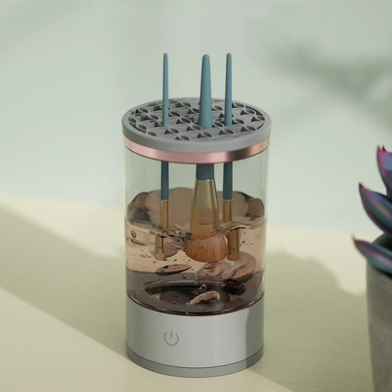 Electric makeup brush cleaner spinning a brush