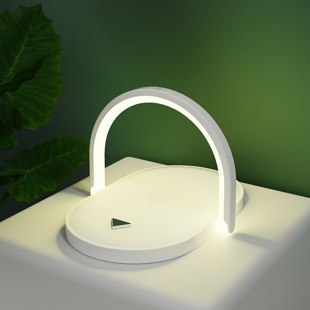 White foldable lamp charging a phone