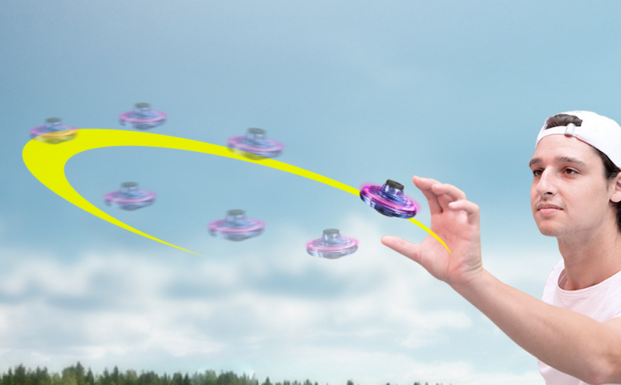 Light-up spinner ball flying back to a hand