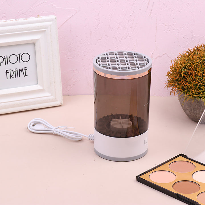 Electric makeup brush cleaner spinning a brush