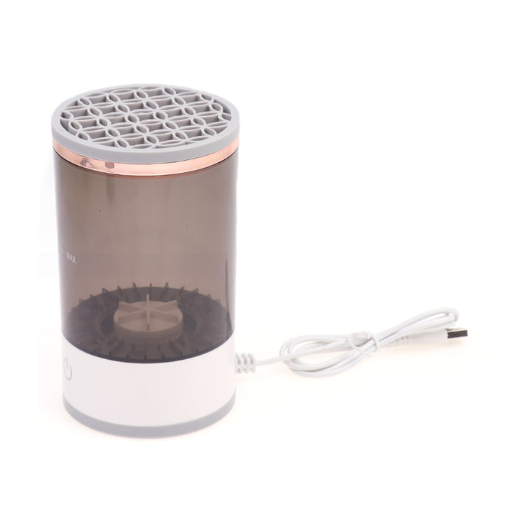 Electric makeup brush cleaner spinning a brush