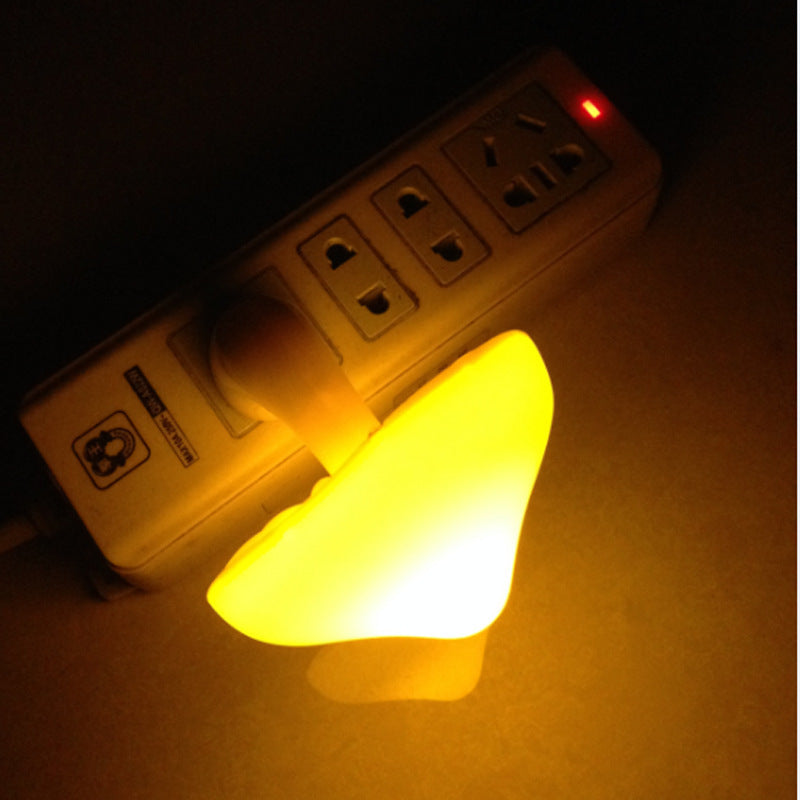 Glowing mushroom night light in wall