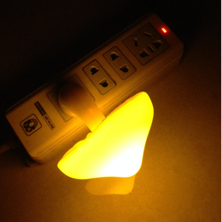 Glowing mushroom night light in wall