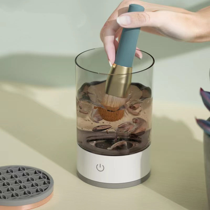 Electric makeup brush cleaner spinning a brush
