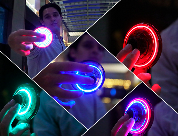 Light-up spinner ball flying back to a hand