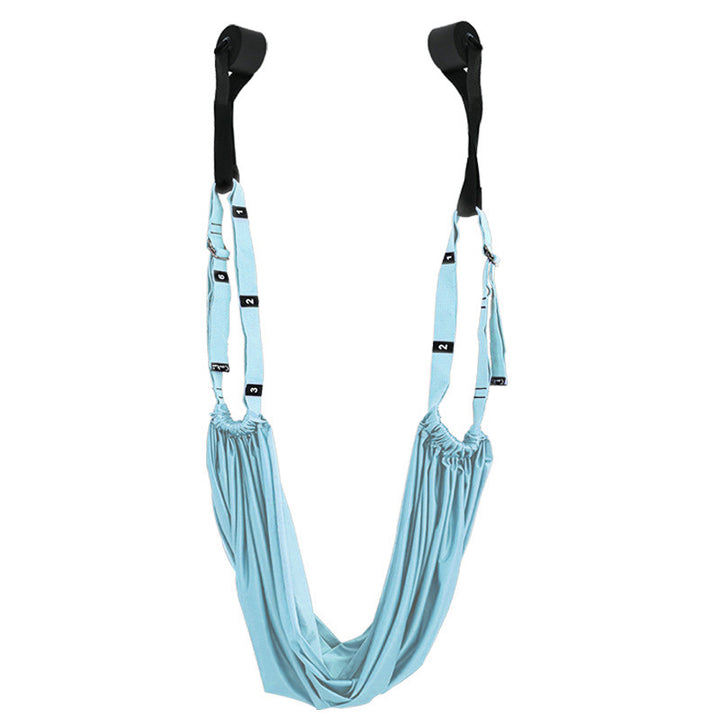 Yoga stretch strap hanging from a door
