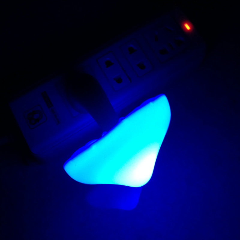 Glowing mushroom night light in wall