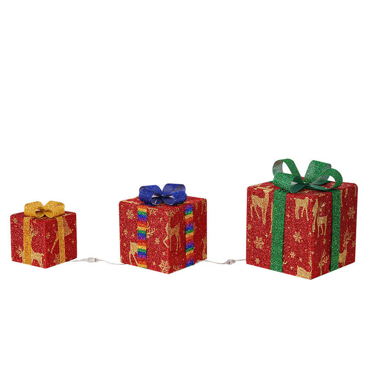 Three light up Christmas gift boxes with bows
