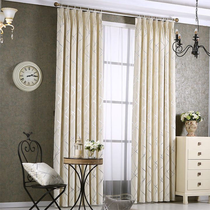Grey chenille blackout curtain at window