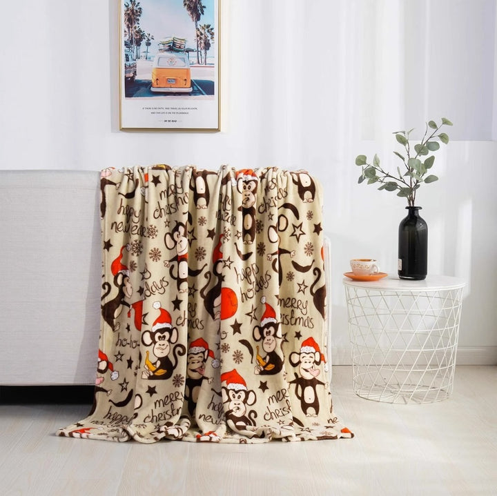 Christmas fleece throw blanket on a sofa