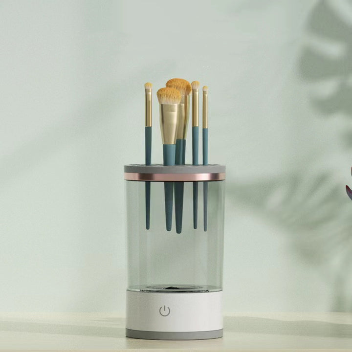 Electric makeup brush cleaner spinning a brush